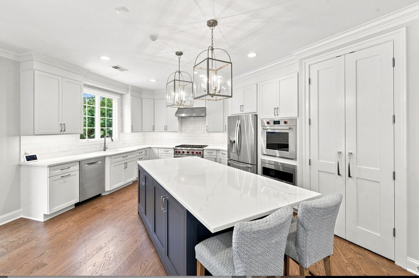 Gourmet kitchen with oversized quartz island