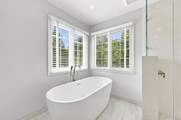 Freestanding soaking tub and glass shower